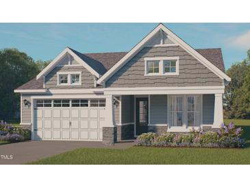 Charming craftsman-style home with stone accents, a white garage door, and a well-manicured lawn at 9172 Dupree Meadow Dr # 16, Angier, NC 27501