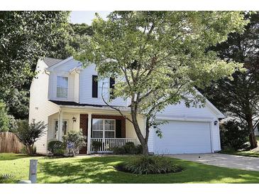 Charming two-story home with white siding, attached garage, and well-manicured lawn at 6229 Saybrooke Dr, Raleigh, NC 27604
