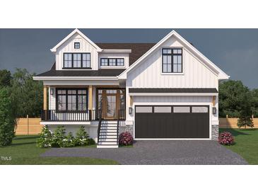 Charming two-story home with a black metal roof, white siding, and a black garage door at 135 Gary Rd, Carrboro, NC 27510