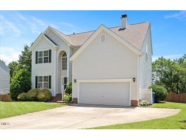 Charming two-story home with white siding, well-manicured lawn, and a two-car garage at 2644 Bloomsberry Ridge Dr, Fuquay Varina, NC 27526