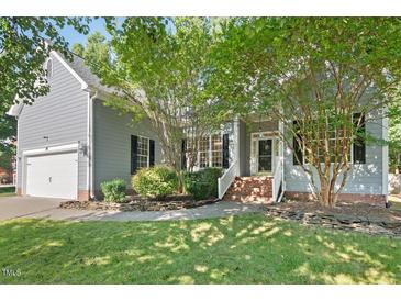 Charming home with a well-maintained lawn and inviting front entrance framed by mature trees at 3 Waconda Ct, Durham, NC 27713
