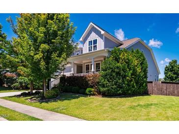 Charming two-story home with a well-manicured front yard and welcoming porch at 42 Juneberry Dr, Chapel Hill, NC 27516