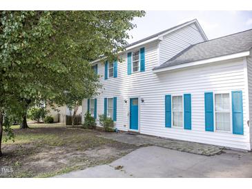 Charming two-story home featuring light-colored siding and eye-catching blue shutters at 103 Sara Dr, Nashville, NC 27856