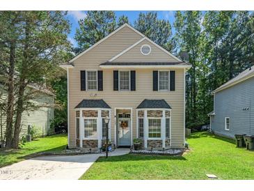 Charming two-story home featuring traditional architecture and a well-maintained front yard at 6008 River Lake Cir, Raleigh, NC 27604