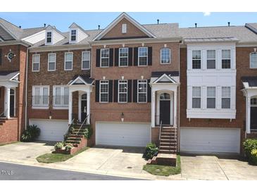 Charming brick townhomes with private garages and inviting front entrances at 2507 Princewood St, Raleigh, NC 27612