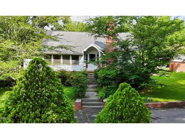 Charming one-story home with lush landscaping and inviting entrance at 2715 E Geer St, Durham, NC 27704