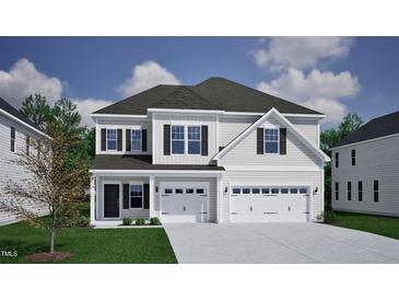 Charming two-story home featuring a two-car garage and welcoming front porch at 40 New Liberty Dr, Youngsville, NC 27596