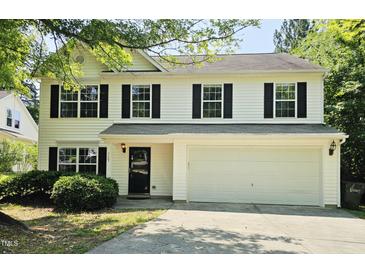 Charming two-story home with black shutters and a well-maintained front yard at 709 Woodgreen Dr, Durham, NC 27704