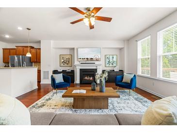 Bright living room with modern fireplace, decor, and furniture creating a cozy and inviting atmosphere at 4963 Highcroft Dr, Cary, NC 27519