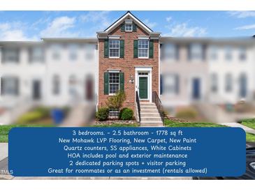 Inviting brick townhome with well-maintained landscaping and a charming green front door at 5505 Crabtree Park Ct, Raleigh, NC 27612
