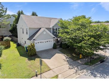 Charming two-story home with a two car garage and mature landscaping at 2037 Summer Shire Way, Raleigh, NC 27604