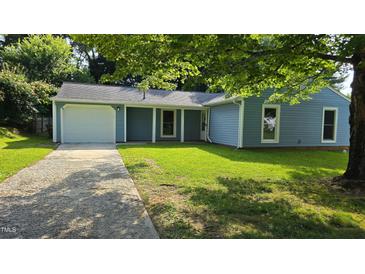 Charming single-story home with a well-maintained lawn and an attached one car garage at 2725 Westchester Dr, Burlington, NC 27217