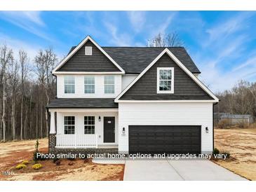 Charming two-story home with white siding, black trim, and a well-manicured lawn at 5428 Jaeger Dr # 45, Graham, NC 27253
