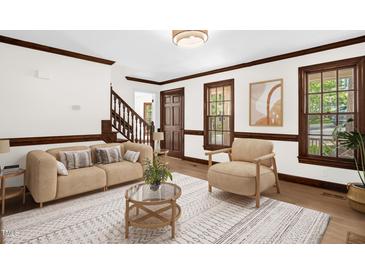 Bright living room featuring hardwood floors, neutral paint, and lovely natural light at 616 Cross Timbers Dr, Durham, NC 27713