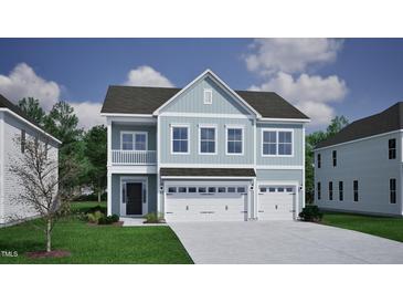 Beautiful two-story home with light blue siding, a three-car garage and a well manicured lawn at 335 Augusta Pond Way # 174, Raleigh, NC 27603