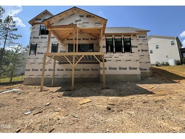 New home construction showing the partially completed back deck and foundation in a residential community at 49 Cloudview Ct, Pittsboro, NC 27312