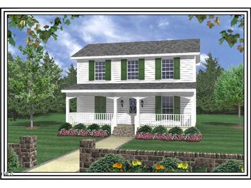 Charming two-story home featuring a welcoming front porch, green shutters, and beautifully landscaped front yard at 605 Sania Ct, Graham, NC 27253