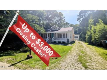 Charming one-story home with a inviting front porch and well-maintained yard with closing cost incentive at 109 N Dunn St, Angier, NC 27501