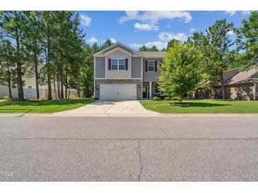 Charming two-story home featuring a two-car garage, stone accents, and well-maintained landscaping at 170 Lothian, Rocky Mount, NC 27804