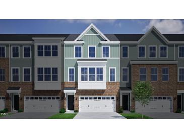 Charming brick townhome with attached garage and classic architectural details at 2112 Pink Peony Cir # 149, Durham, NC 27703