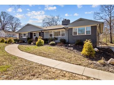 Charming single-story home with a landscaped front yard and a walkway to the entrance at 1603 N Alston Ave, Durham, NC 27701