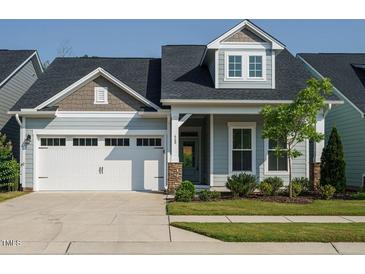 Charming single-Gathering home featuring a two-car garage, craftsman details, and well-maintained landscaping at 660 Still Willow Ln, Wendell, NC 27591