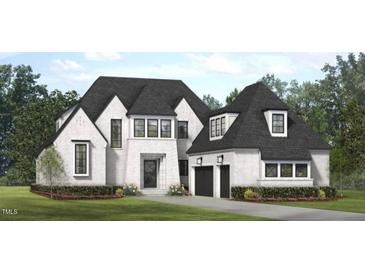Charming two-story home with a brick exterior, black framed windows, and a two-car garage, surrounded by lush landscaping at 1033 Azalea Garden Cir, Raleigh, NC 27603
