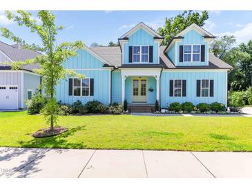 Charming two-story home with a well-manicured lawn and bright, inviting curb appeal at 2635 High Plains Dr, Fuquay Varina, NC 27526