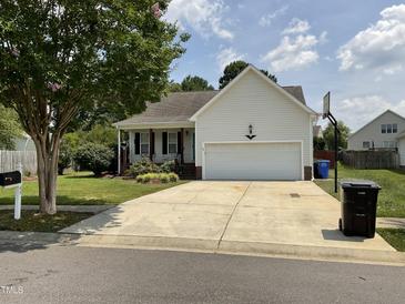 Charming single-Gathering home with a two-car garage, well-manicured lawn, and a traditional design at 44 Glen Meadow Dr, Angier, NC 27501