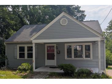 Charming single-story home with a well-maintained gray exterior and a welcoming front porch at 1102 N Guthrie Ave, Durham, NC 27703