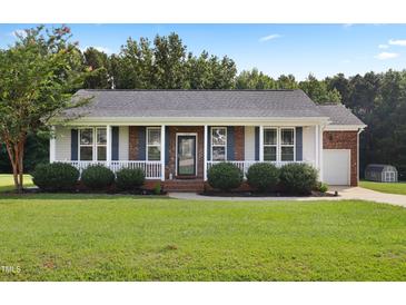 Charming one-story home with a well-maintained lawn and inviting front porch at 139 His Way, Middlesex, NC 27557