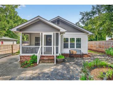 Charming home with a screened front porch, beautiful stone path and cozy seating at 2503 Shirley St, Durham, NC 27705