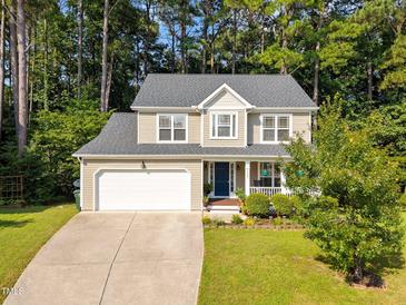 Charming two-story home with a well-manicured lawn and attached two car garage at 4600 Landover Dale Dr, Raleigh, NC 27616