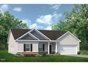 Charming single-Gathering home with a manicured lawn and attached two car garage at 521 Olivia Crossing Ct # 19, Four Oaks, NC 27524