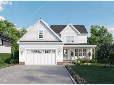 Charming two-story home showcasing a manicured lawn, gray roof, inviting porch, and attached two car garage at 1004 Snow Peak Ct, Raleigh, NC 27603