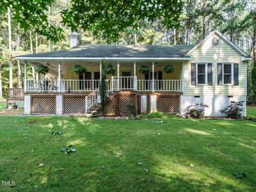 Charming home featuring a large front porch and well-maintained yard at 45 Softwood Dr, Franklinton, NC 27525