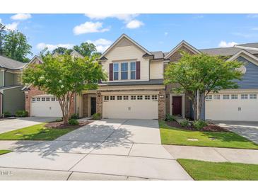 Charming townhome featuring a well-manicured lawn, neutral colors and a spacious driveway at 236 Lynchwick Ln, Durham, NC 27703