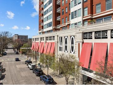 Modern condo building at 400 with red awnings, and beautiful architecture at 400 W North St # 900, Raleigh, NC 27603