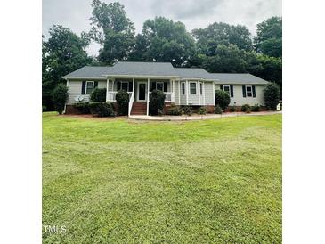 Charming single-story home with a welcoming front porch and well-manicured lawn at 175 Ann Dr, Timberlake, NC 27583