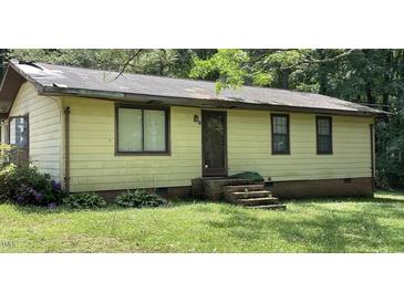 Modest single-story home featuring a simple facade and a compact front yard at 181 Mangums Dr, Wendell, NC 27591