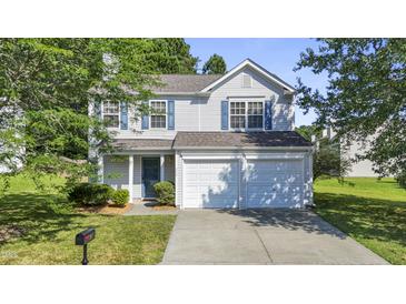 Charming two-story home with a well-maintained lawn and attached two-car garage at 211 Cloverdale Dr, Durham, NC 27703