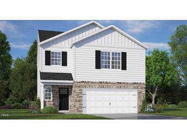 New two-story home with white siding, stone accents, a black front door, and a two-car garage at 136 Global Ave, Fuquay Varina, NC 27526