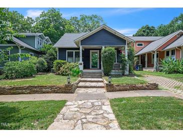 Charming single-story home with stone walkway and inviting curb appeal at 1213 Pierce St, Raleigh, NC 27605