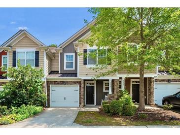 Charming townhome with a one-car garage and welcoming front porch at 449 Christian Creek Pl, Cary, NC 27519