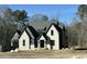 Handsome two-story home with a prominent entrance, dark-trimmed windows and a professionally landscaped yard at 3812 Peaceful Creek Trl, Zebulon, NC 27597