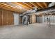 Utility-ready basement features exposed ceiling ducts, insulated walls, and a door for easy access at 164 Clove Hitch Ln, Fuquay Varina, NC 27526