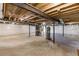 Unfinished basement with water tanks, beams, and white plastic-covered walls at 164 Clove Hitch Ln, Fuquay Varina, NC 27526