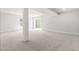 Spacious finished basement with neutral carpet, natural light, and access to outdoors at 164 Clove Hitch Ln, Fuquay Varina, NC 27526