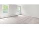 Sunlit bedroom with plush carpeting, offering a serene and comfortable space for rest and relaxation at 164 Clove Hitch Ln, Fuquay Varina, NC 27526
