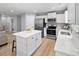 Kitchen with center island, stainless appliances, and white cabinets at 164 Clove Hitch Ln, Fuquay Varina, NC 27526